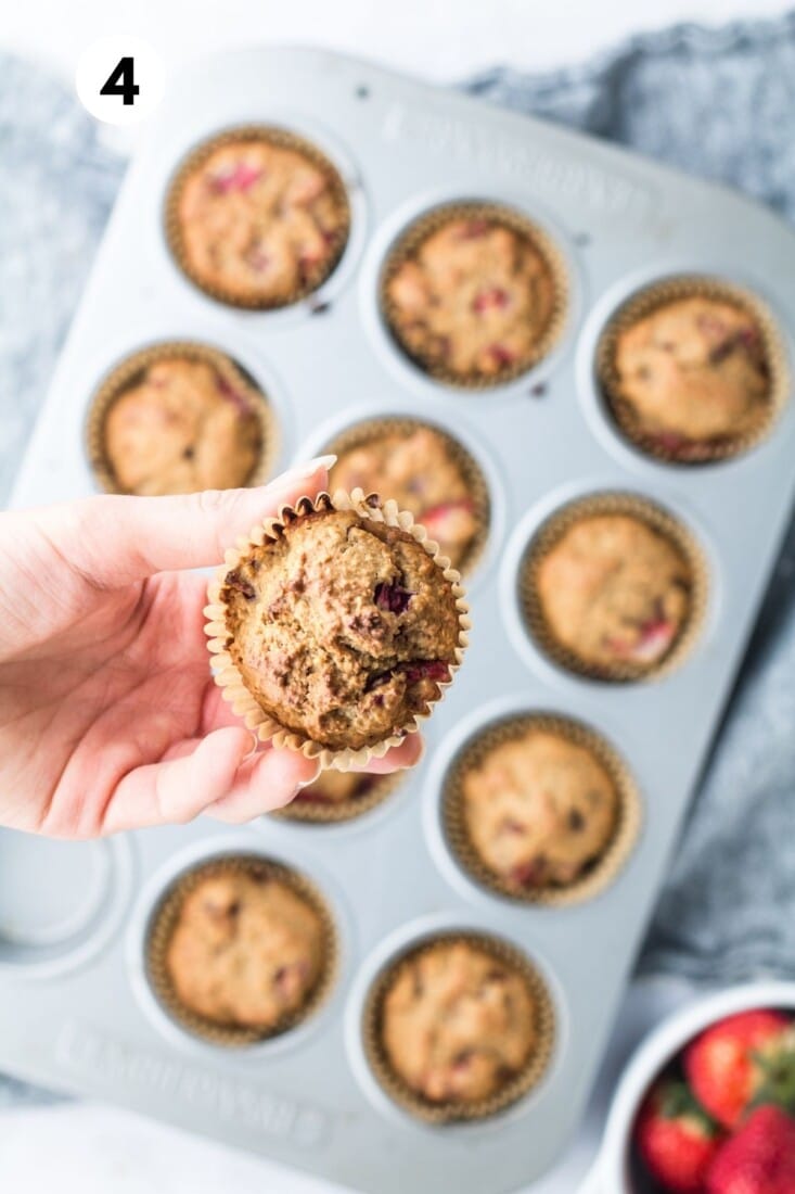 Strawberry muffins in a muffin tin.