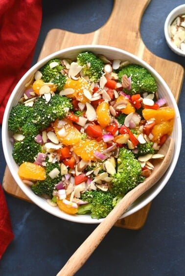 Healthy Asian Broccoli Salad is a delicious low calorie broccoli salad mixed with almonds, veggies, mandarin oranges and an Asian marinade. Served chilled for a super healthy side salad or appetizer!