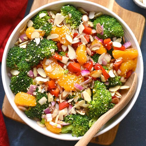 Healthy Asian Broccoli Salad is a delicious low calorie broccoli salad mixed with almonds, veggies, mandarin oranges and an Asian marinade. Served chilled for a super healthy side salad or appetizer!