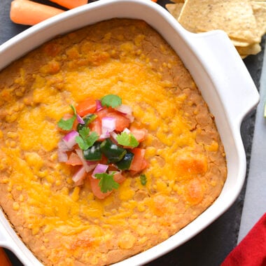 Healthy Pinto Bean Dip recipe is made low calorie and higher in protein. A simple and delicious healthy bean dip recipe that ready in 15-minutes. Great served as a snack or party appetizer!