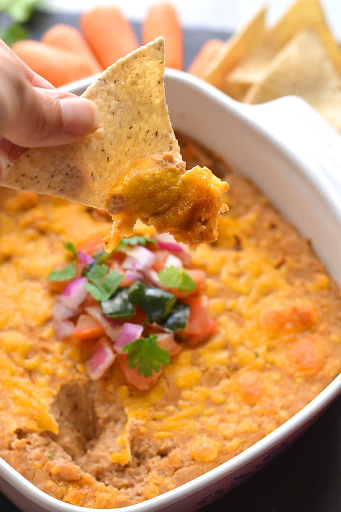 Healthy Pinto Bean Dip recipe is made low calorie and higher in protein. A simple and delicious healthy bean dip recipe that ready in 15-minutes. Great served as a snack or party appetizer!