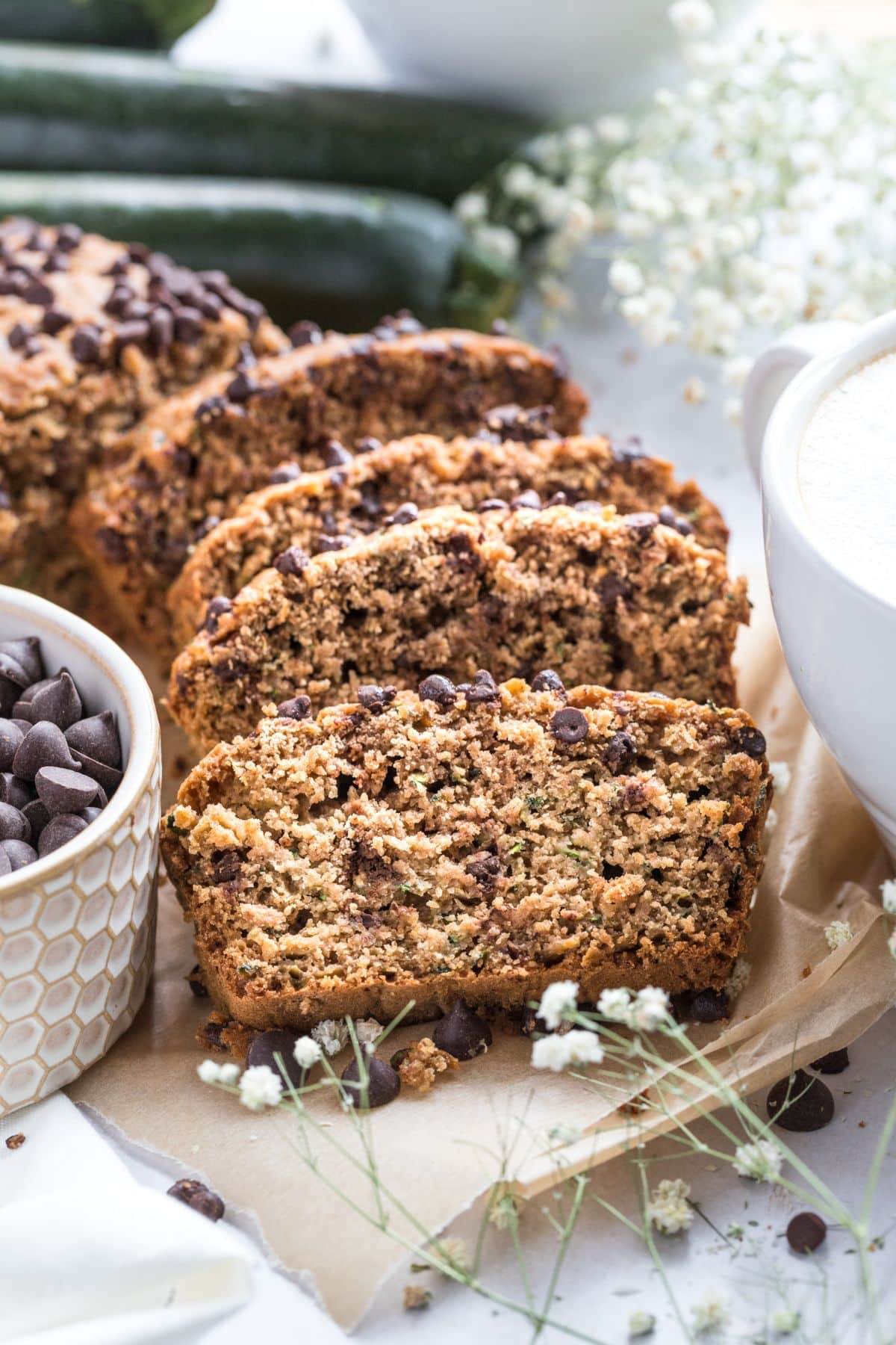 Slices of low calorie zucchini bread leaning over on each other.