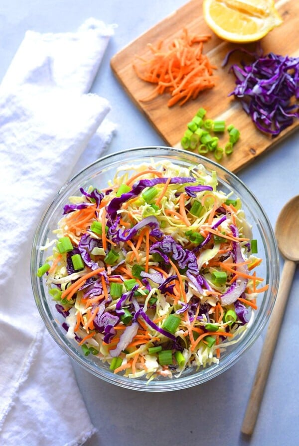Healthy Low Calorie Coleslaw made with Greek yogurt instead of mayo and no added sugar. This simple, healthy coleslaw recipe is bursting with vegetables and nutrients while being lower in calories and fat.