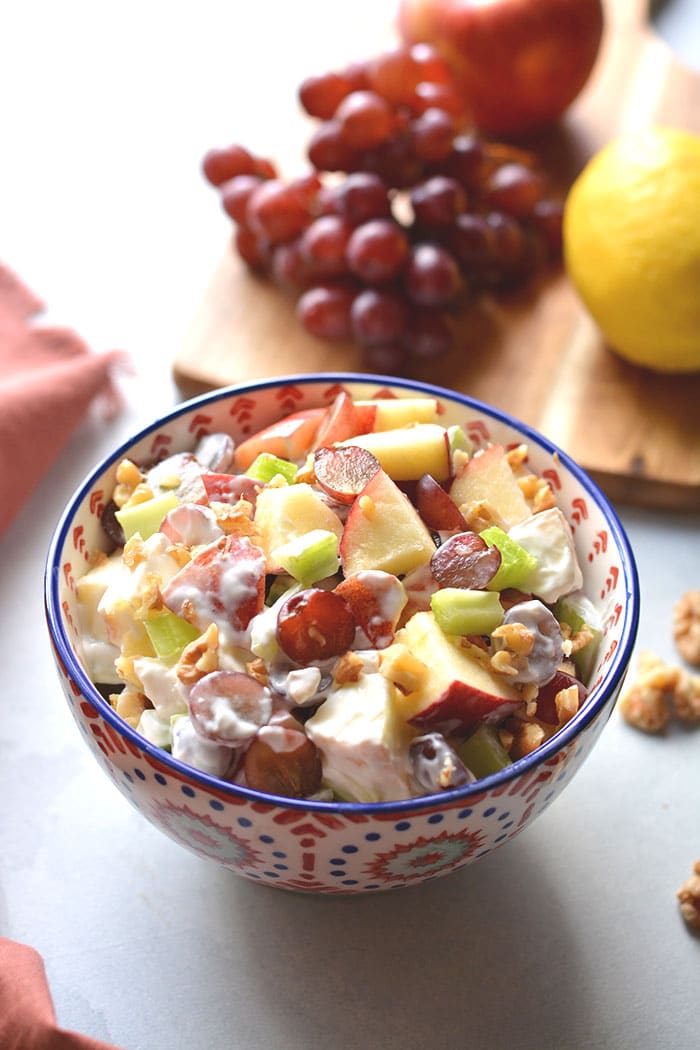 Healthy Waldorf Salad is made low calorie with a creamy, lemon Greek yogurt sauce with no added sugar and no mayo.  A healthy side dish or appetizer that's easy to make, naturally gluten free and delicious! Gluten Free + Low Calorie