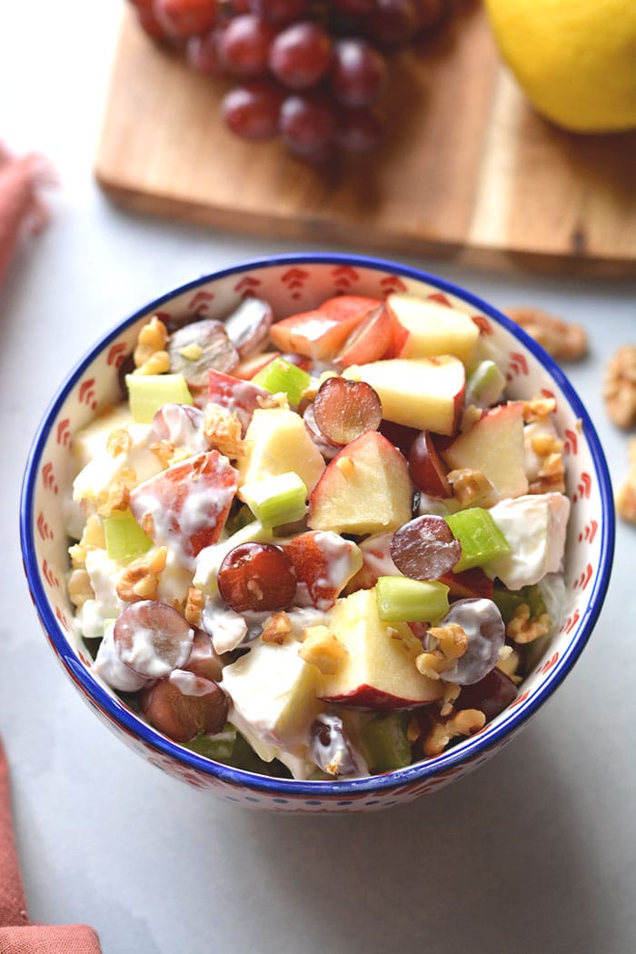 Healthy Waldorf Salad is made low calorie with a creamy, lemon Greek yogurt sauce with no added sugar and no mayo.  A healthy side dish or appetizer that's easy to make, naturally gluten free and delicious! Gluten Free + Low Calorie