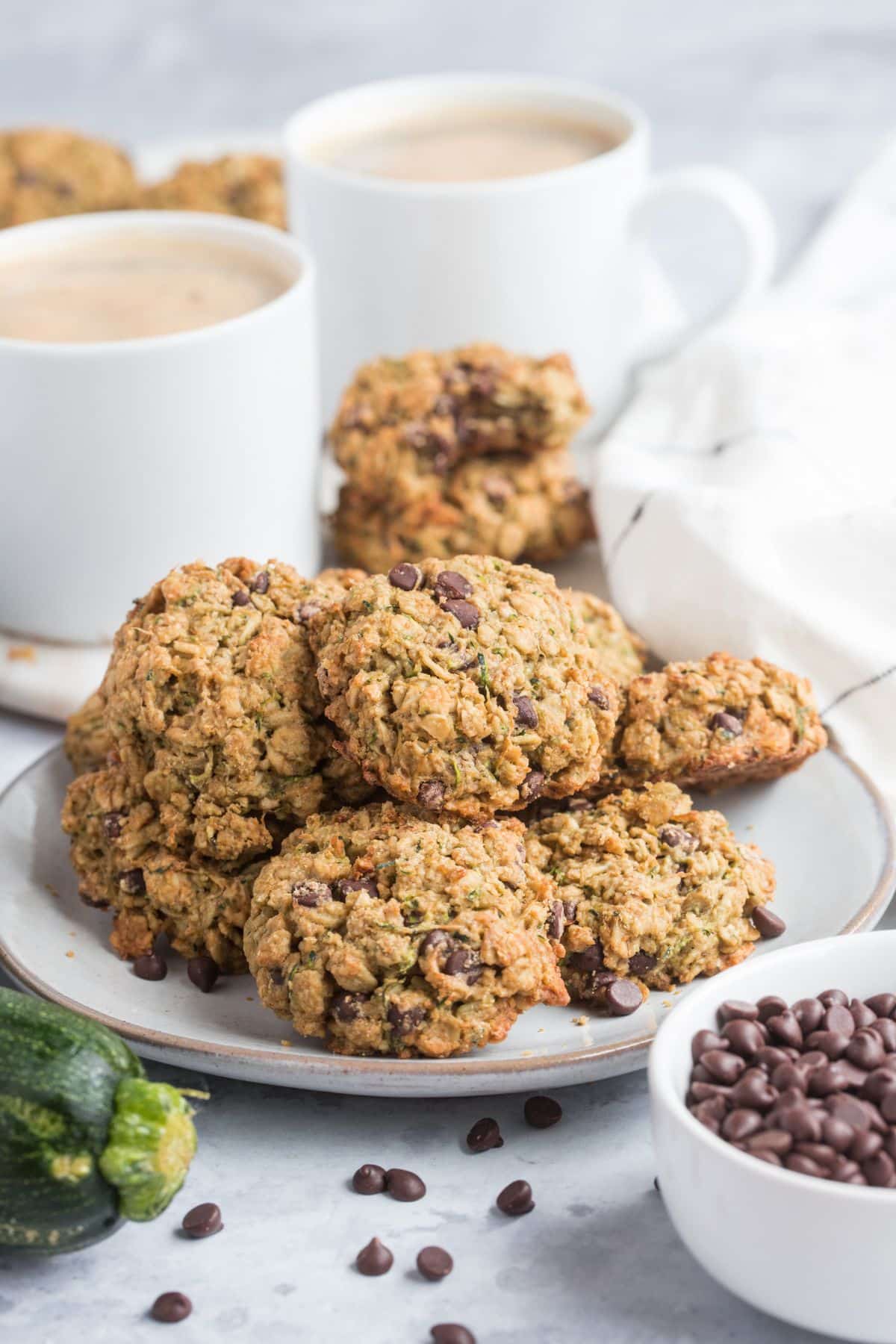 Zucchini chocolate chip cookies on a white plate.
