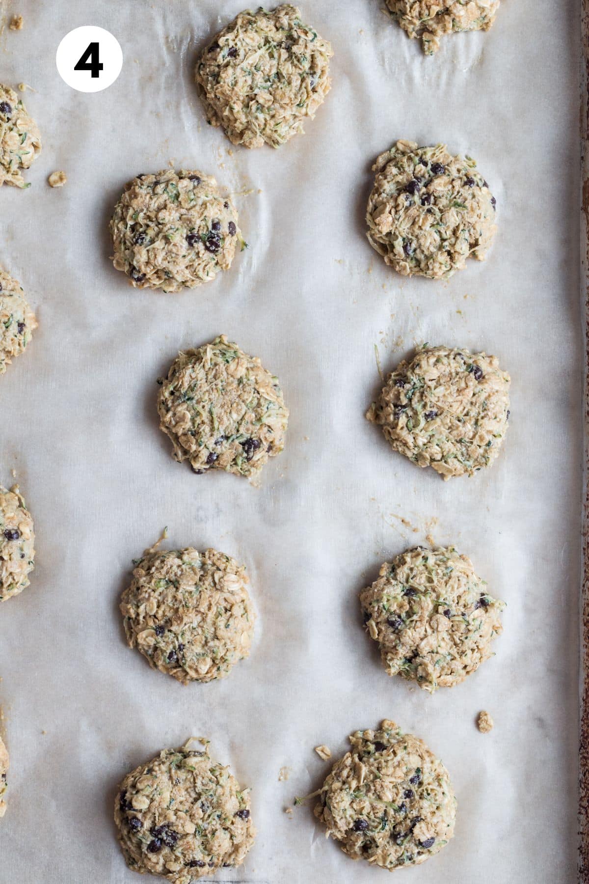 Cookie dough scooped onto a baking sheet.