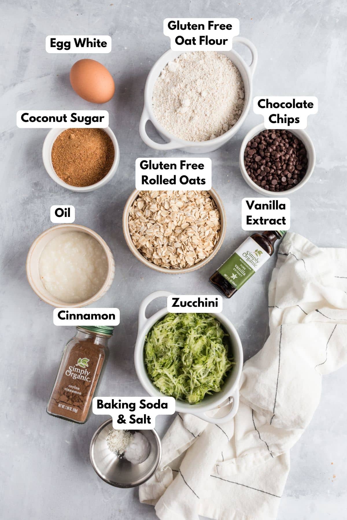 Ingredients for making zucchini chocolate chip cookies in bowls.