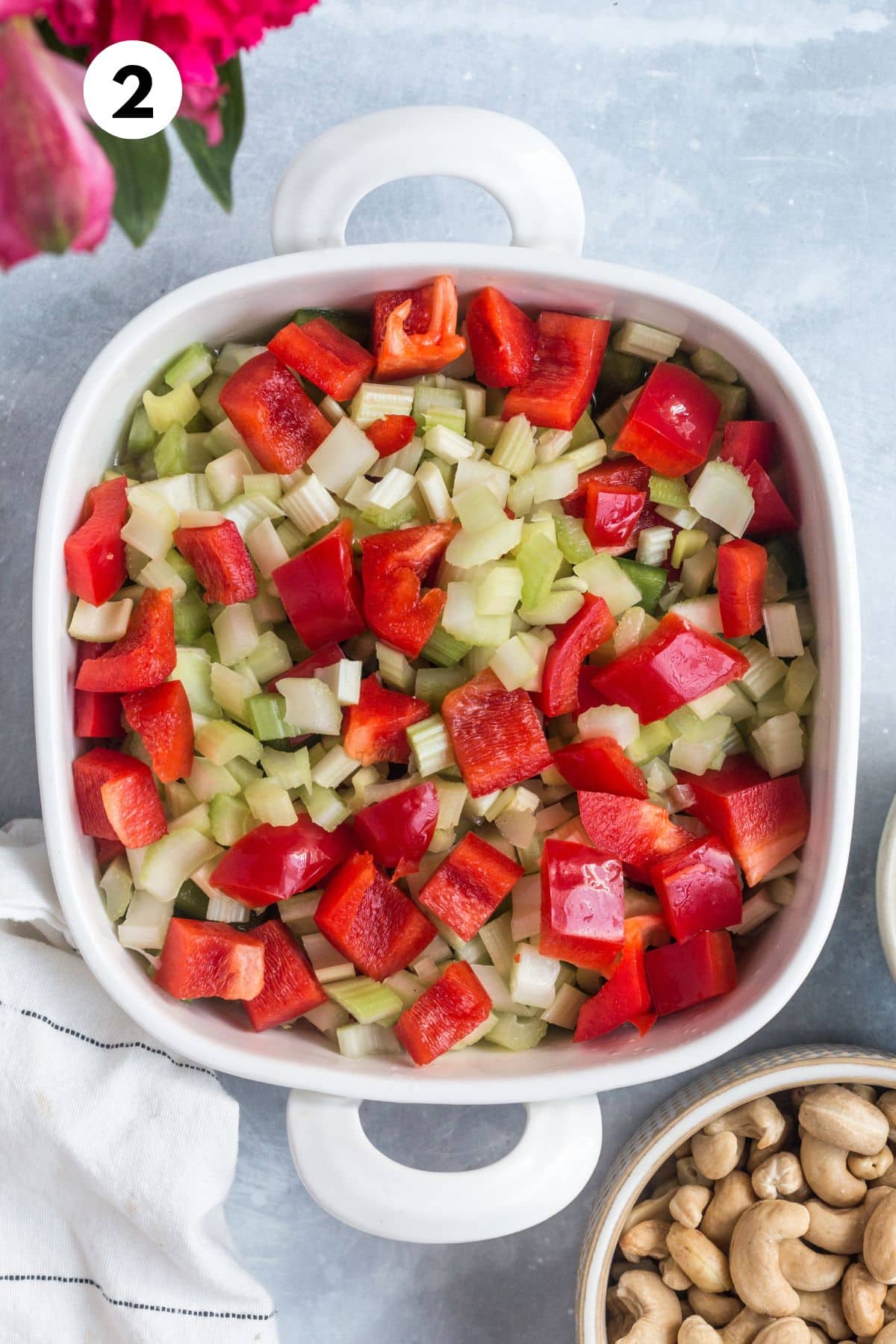 Veggies added to the casserole dish.