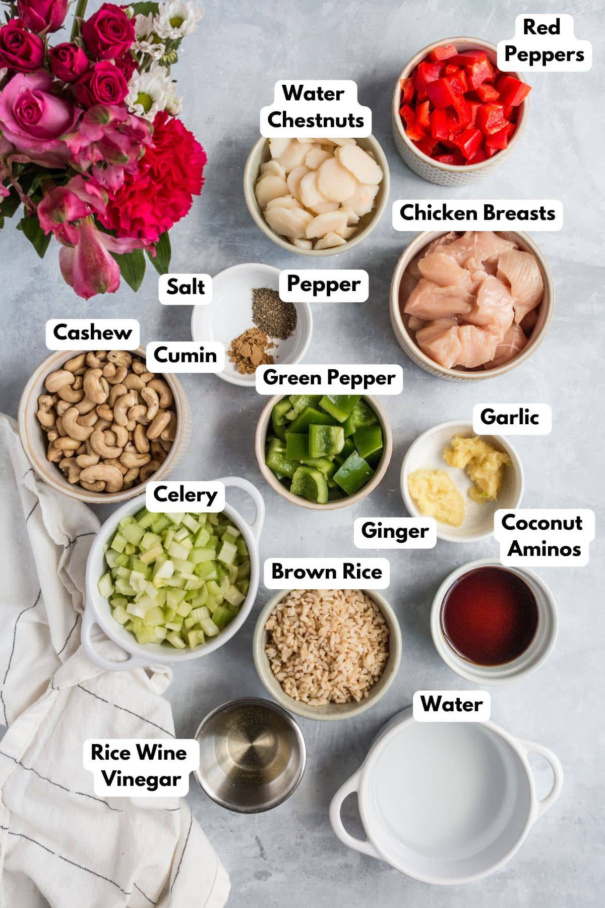 Ingredients for making cashew chicken bake in bowls.