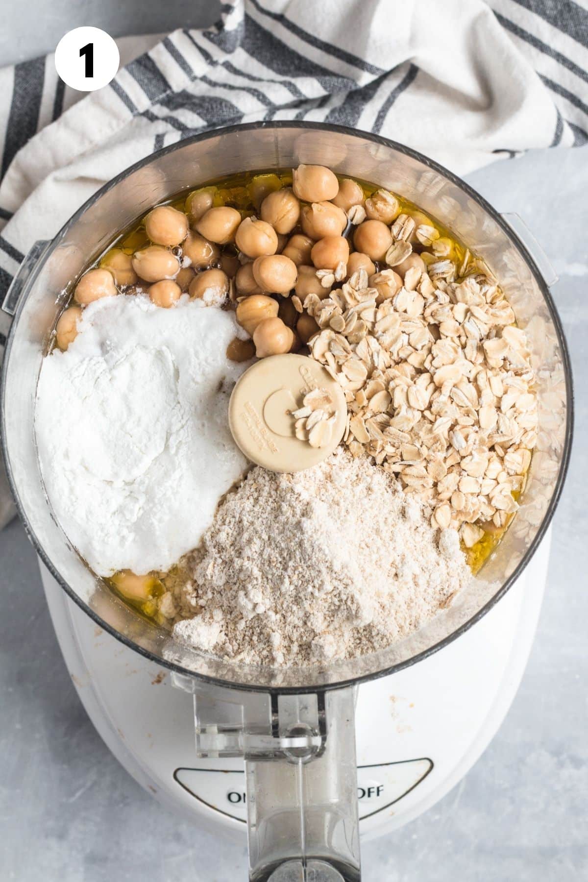 Blueberry donut ingredients added to a food processor.