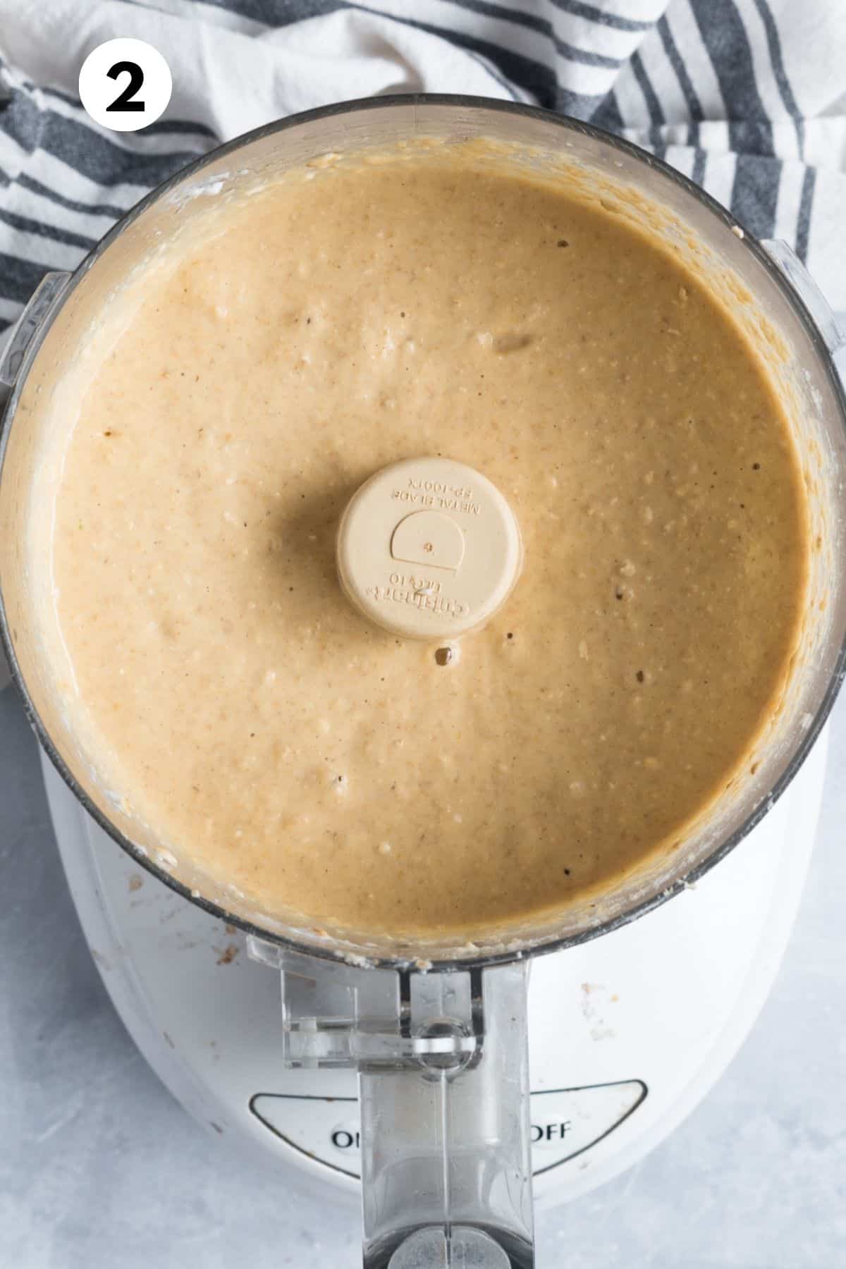 Blueberry donut ingredients blended together in a food processor.