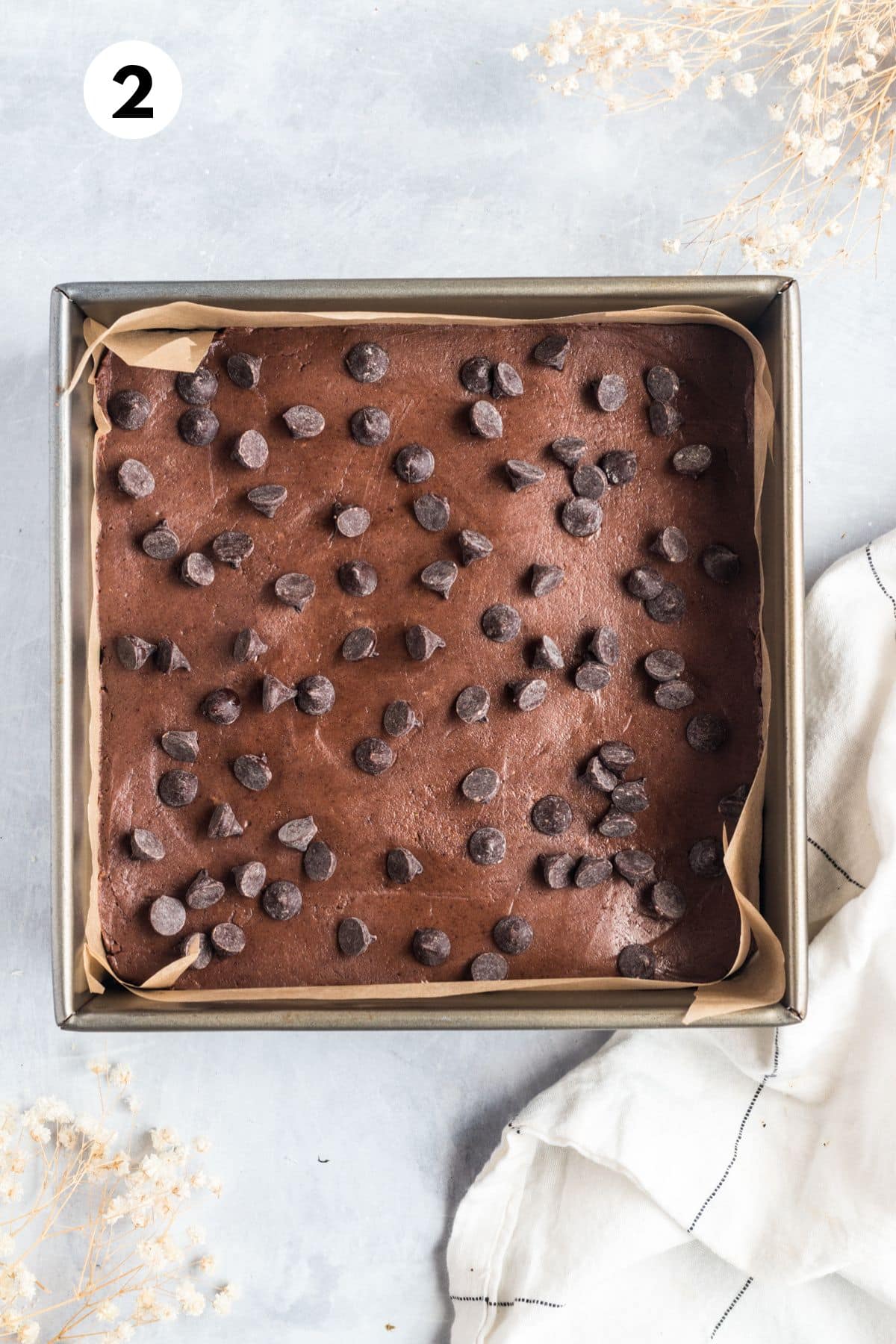 Unbaked chocolate protein bars in a baking dish.