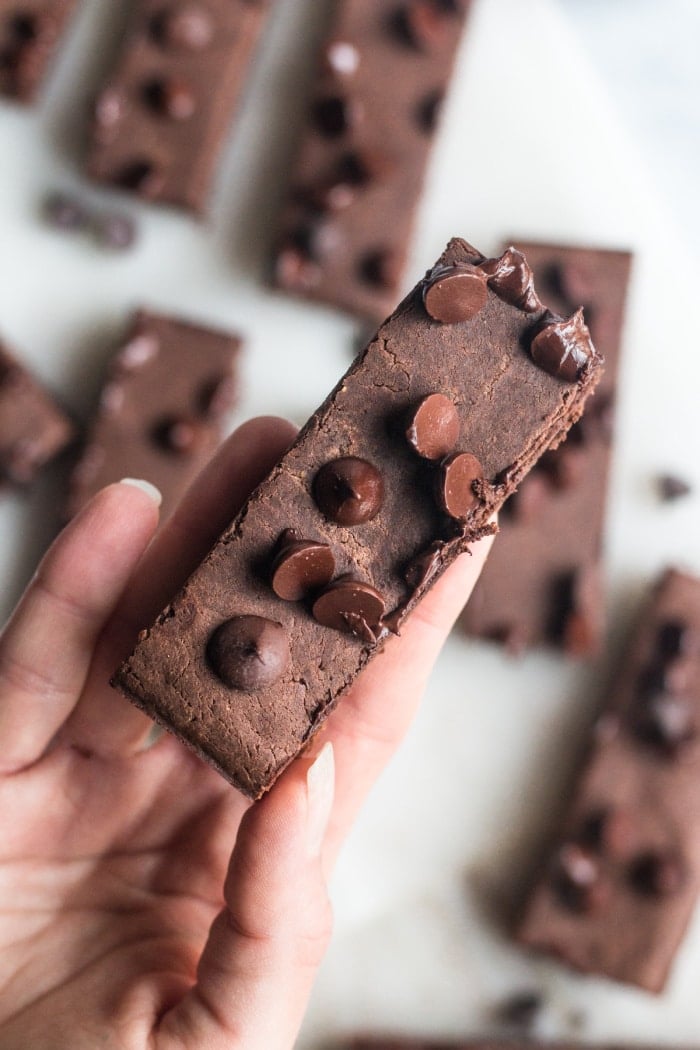 Healthy Chocolate Protein Bars are made with 6 real food ingredients and no added sugar. The perfect low calorie and gluten free protein snack that's simple to make and a treat even picky eaters will love!