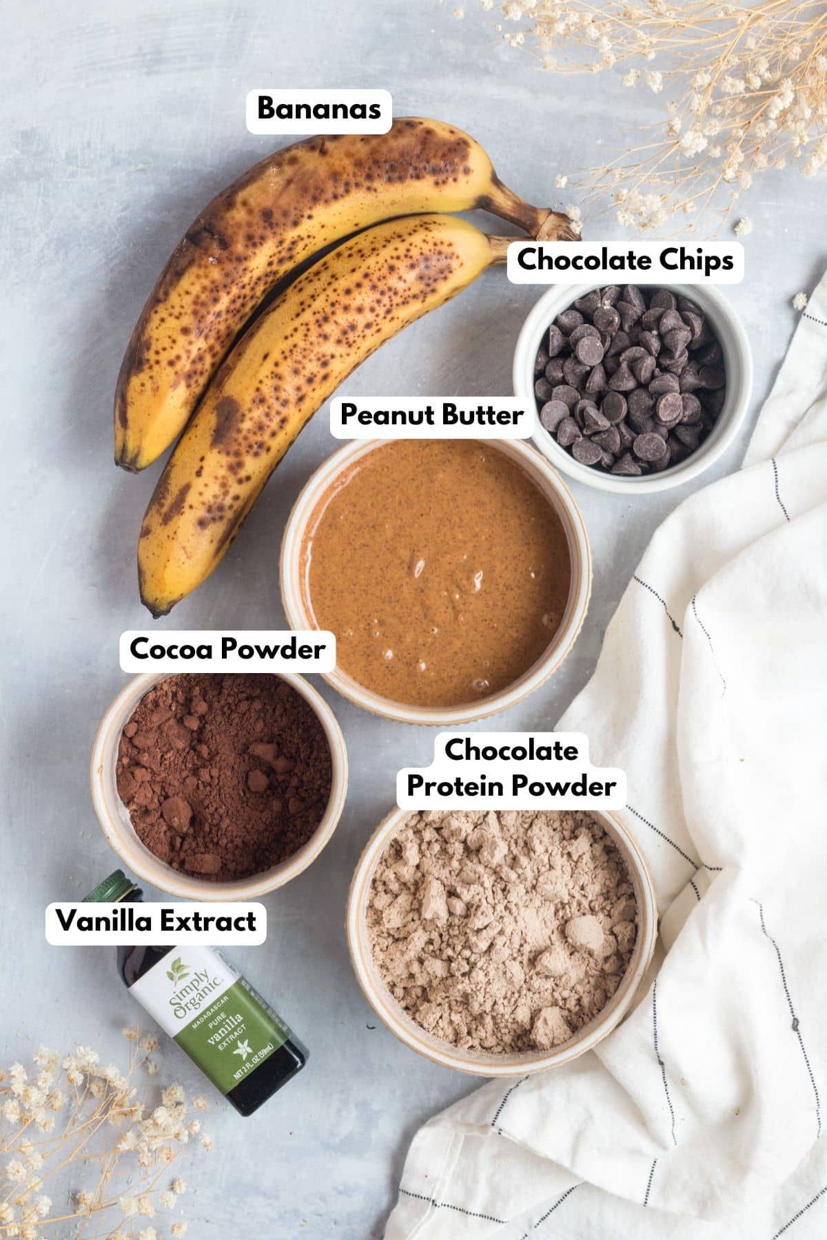 Ingredients to make healthy chocolate protein bars on a table.