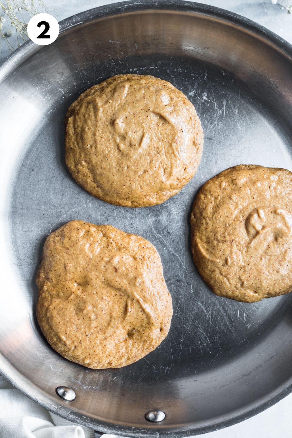 Pumpkin panacke batter on a skillet.