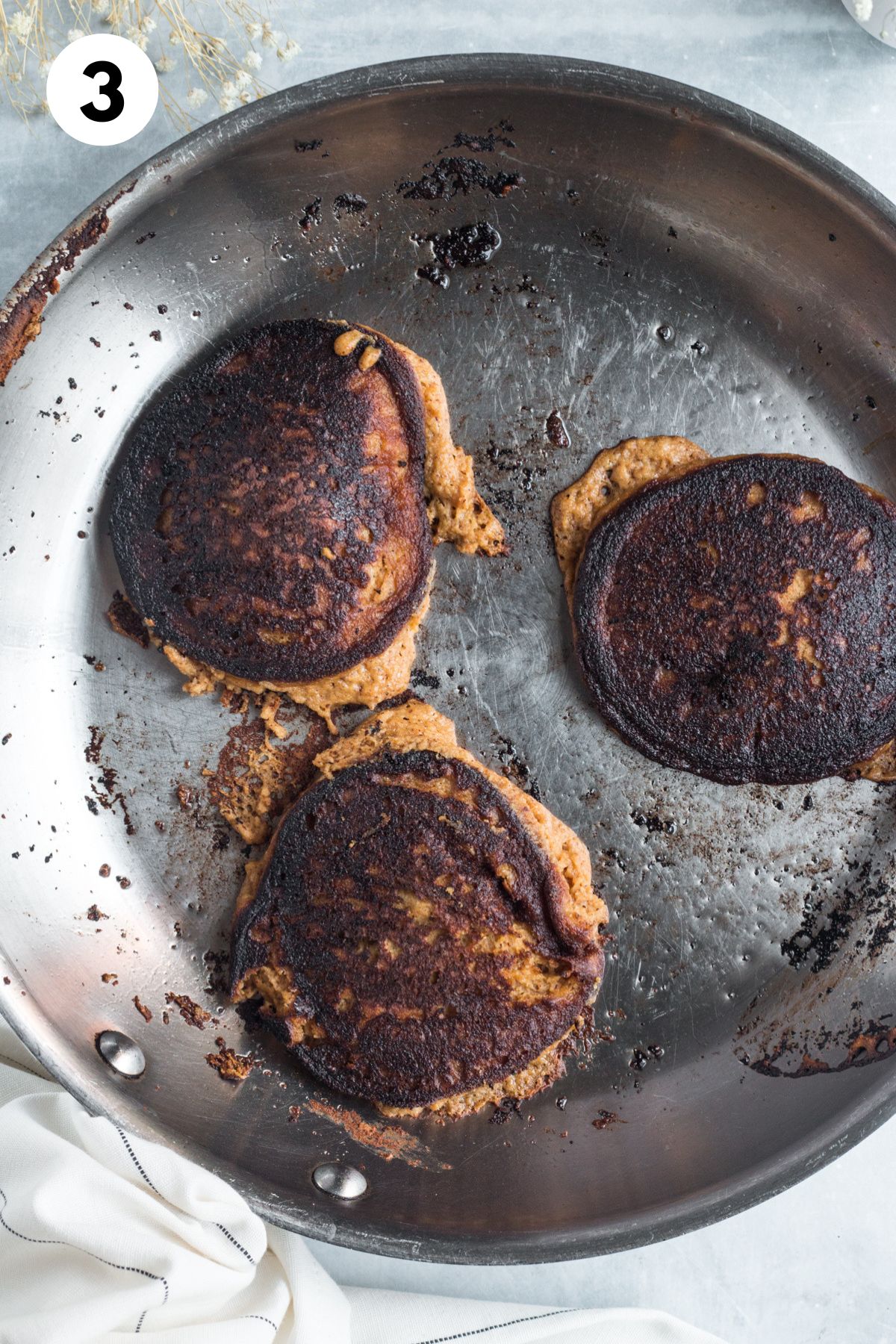 Cooked pumpkin pancakes on a skillet.