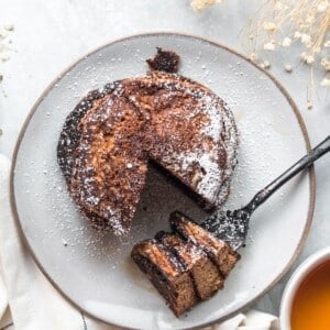 A stack of gluten-free pumpkin with a slice taken out.