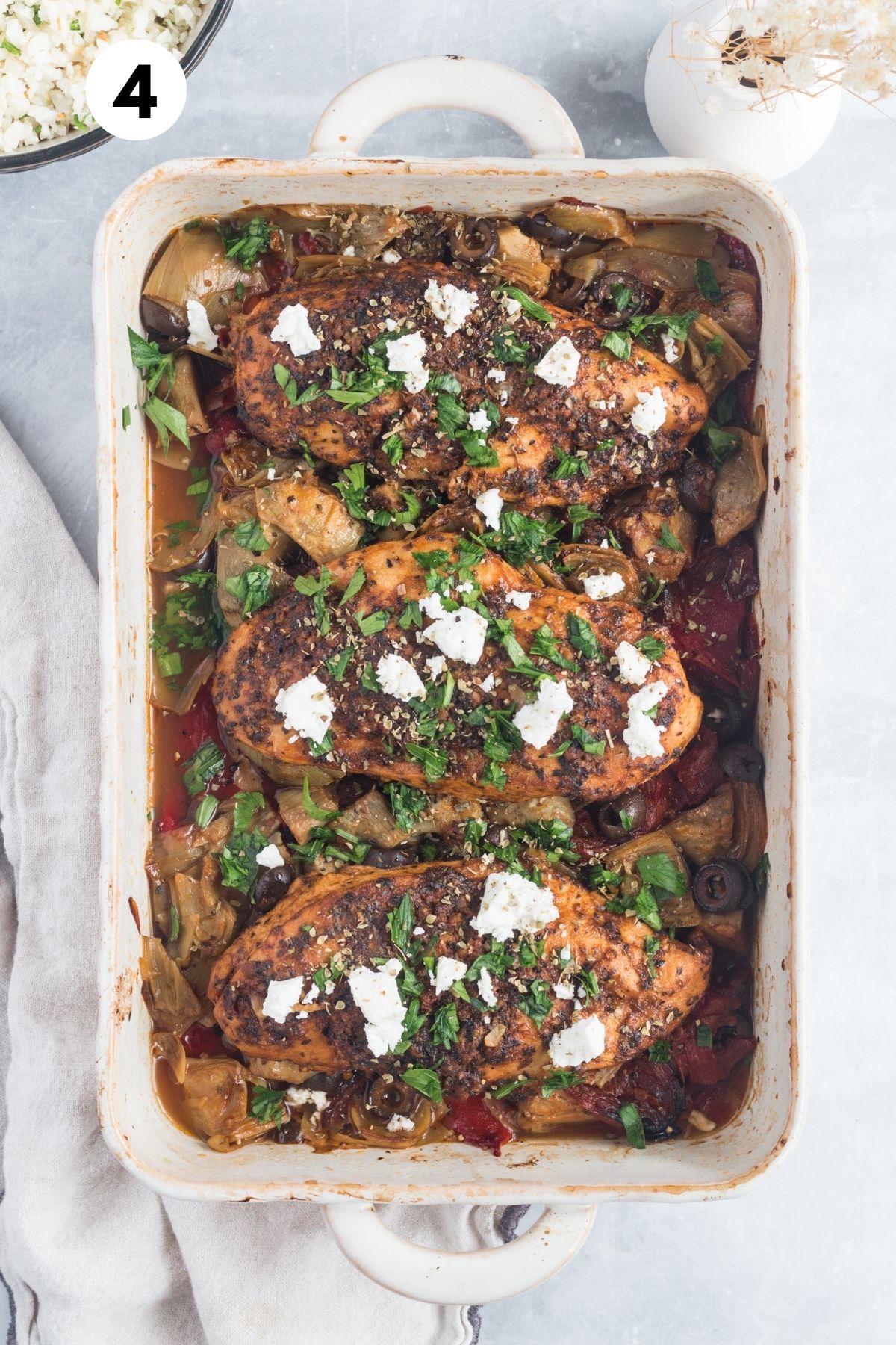 Baked Greek chicken casserole in a baking dish.