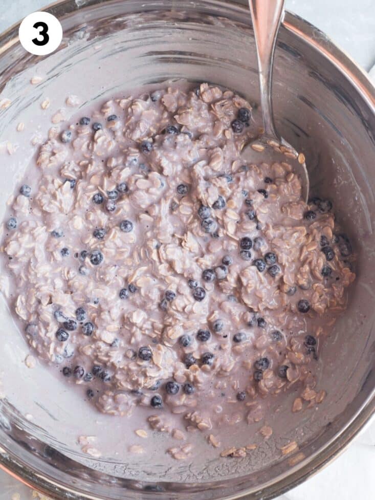 Oatmeal and liquid all mixed together in a bowl.