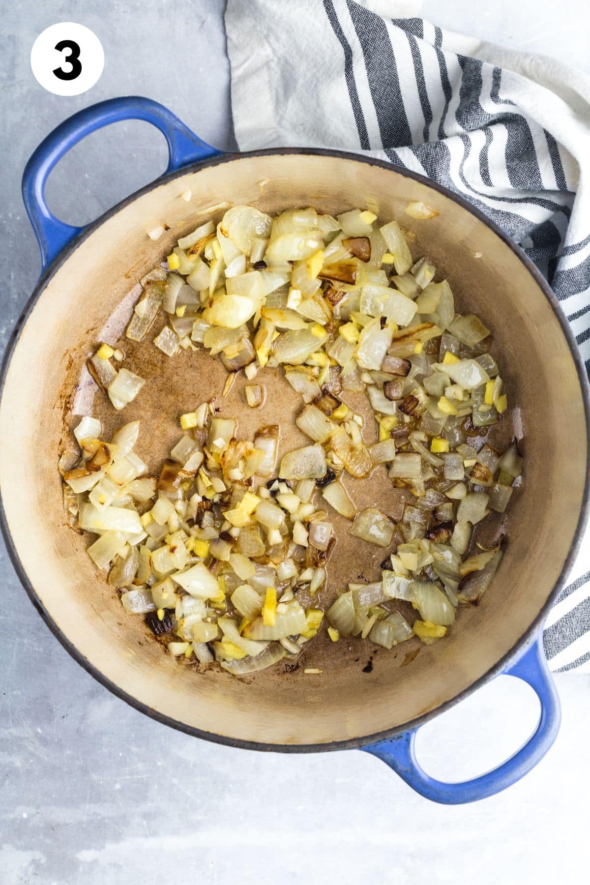Aromatics being sauteed in a pot.