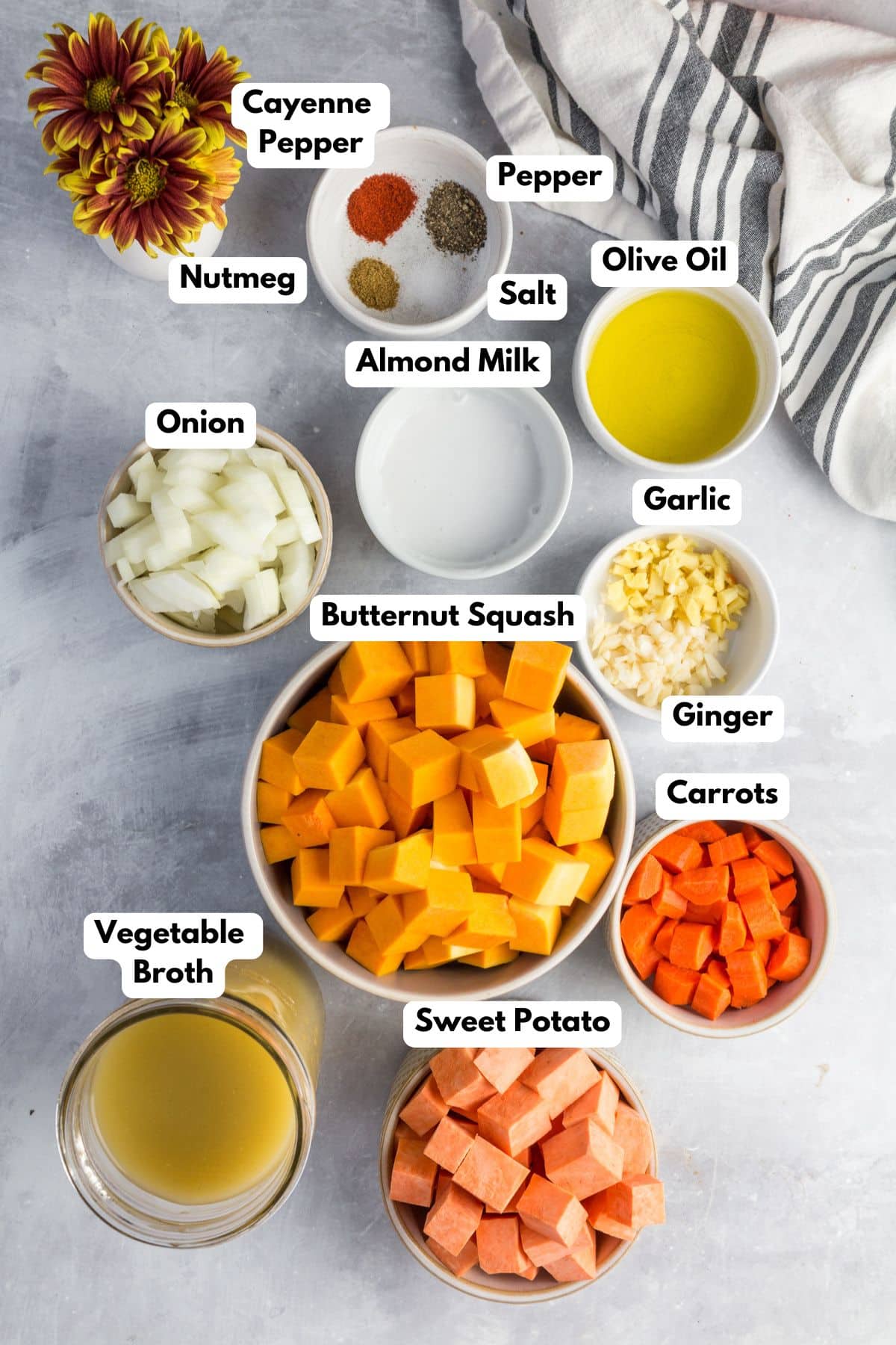 Ingredients for making butternut squash and sweet potato soup in bowls.