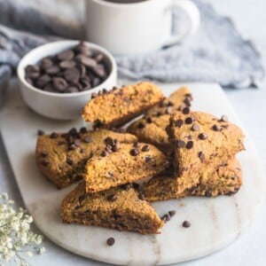 Gluten free pumpkin scones on a serving plate.