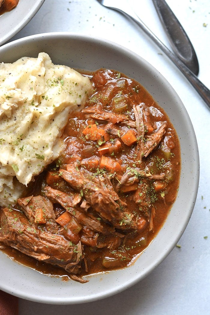 Healthy Crockpot Ragu is loaded with veggies and protein. A cozy meal that's incredibly hearty and delicious, gluten free, low calorie and Paleo friendly! Perfect for meal prepping ahead of time or for a weeknight meal that's virtually effortless. 