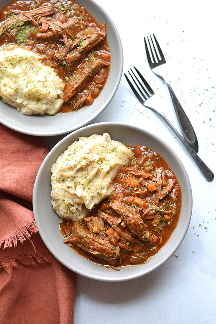 Healthy Crockpot Ragu is loaded with veggies and protein. A cozy meal that's incredibly hearty and delicious, gluten free, low calorie and Paleo friendly! Perfect for meal prepping ahead of time or for a weeknight meal that's virtually effortless. 