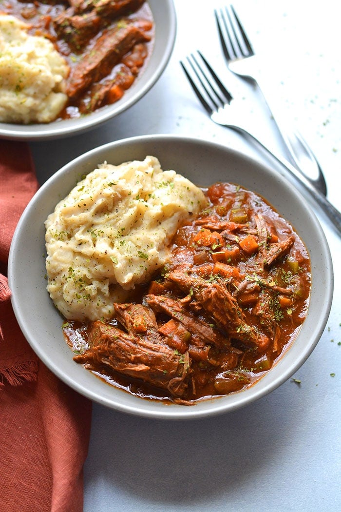 Healthy Crockpot Ragu is loaded with veggies and protein. A cozy meal that's incredibly hearty and delicious, gluten free, low calorie and Paleo friendly! Perfect for meal prepping ahead of time or for a weeknight meal that's virtually effortless. 