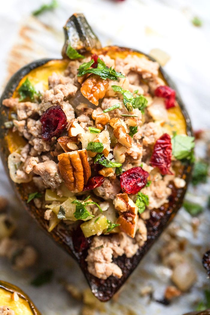Healthy Stuffed Acorn Squash is low calorie, gluten free and delicious. A simple, healthy dinner packed with flavor that's filling, better balanced in nutrition and has fewer calories!