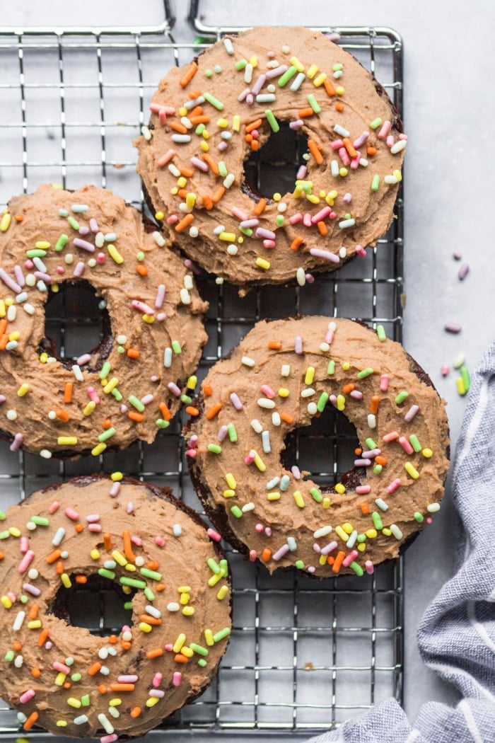 Healthy Chocolate Protein Donuts made low calorie and gluten free with a lighter cream cheese protein frosting. A delicious, healthy protein donut recipe that's versatile and easy to make.