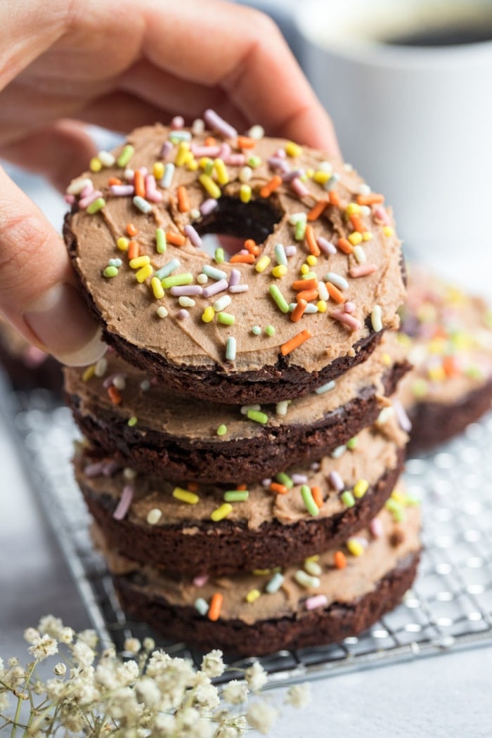 Healthy Chocolate Protein Donuts made low calorie and gluten free with a lighter cream cheese protein frosting. A delicious, healthy protein donut recipe that's versatile and easy to make.