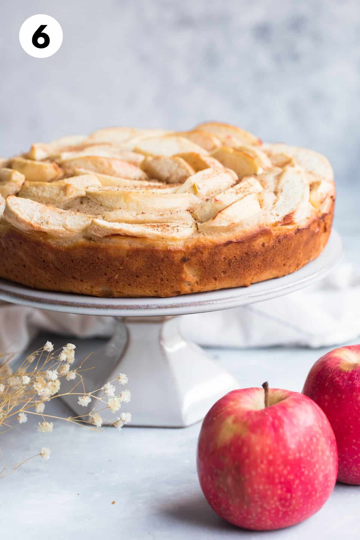 Baked Greek yogurt cake on a cake stand.