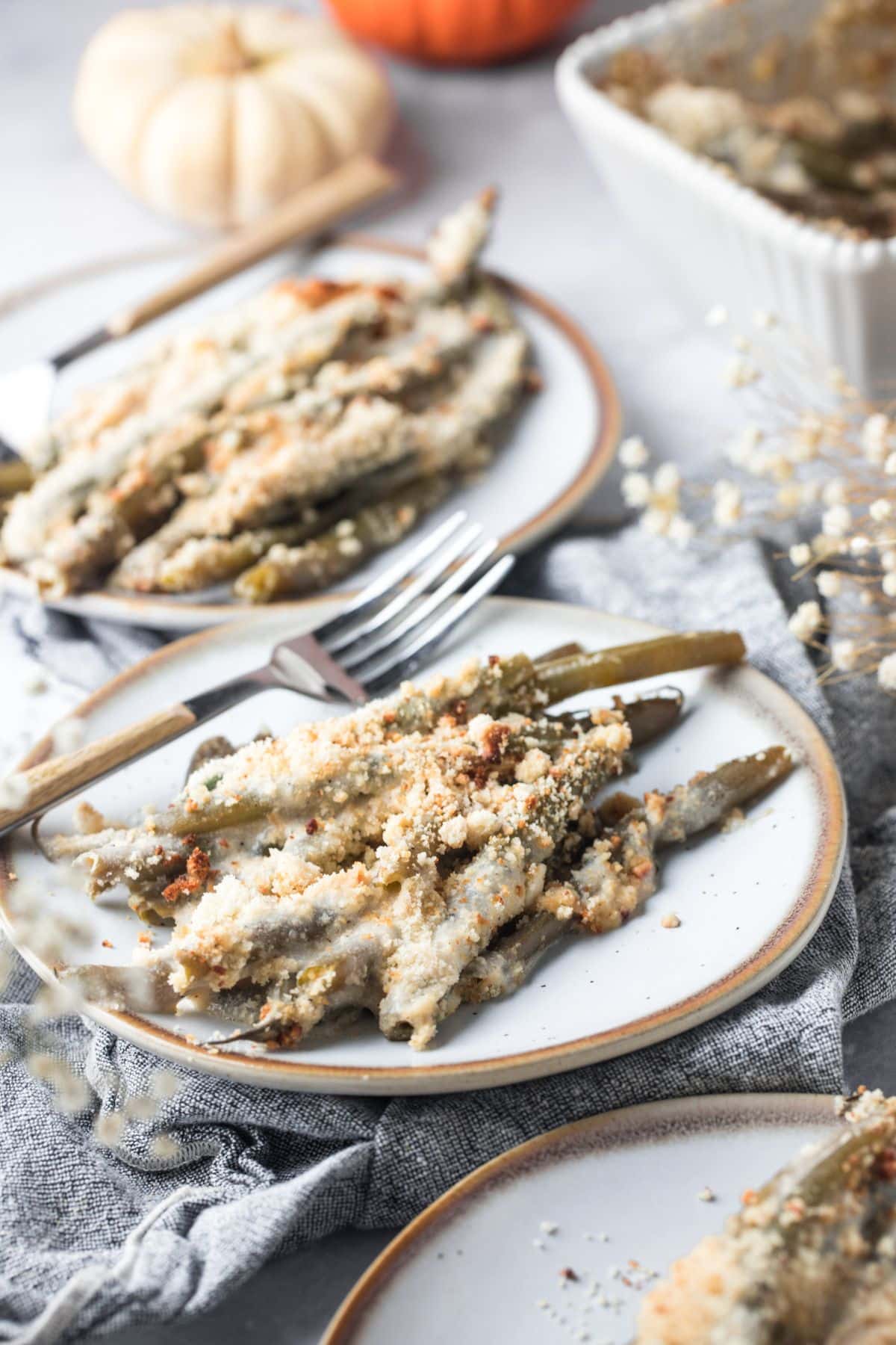 Healthy green bean casserole served on plates.