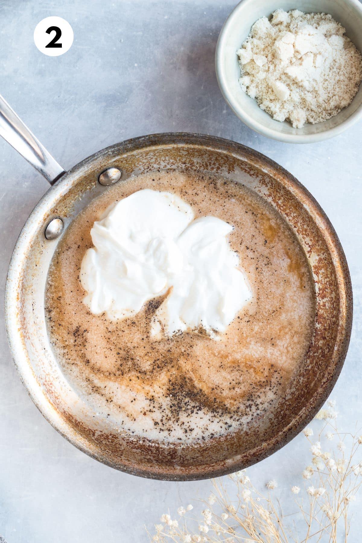 Ingredients for making green bean casserole sauce in a saucepan.