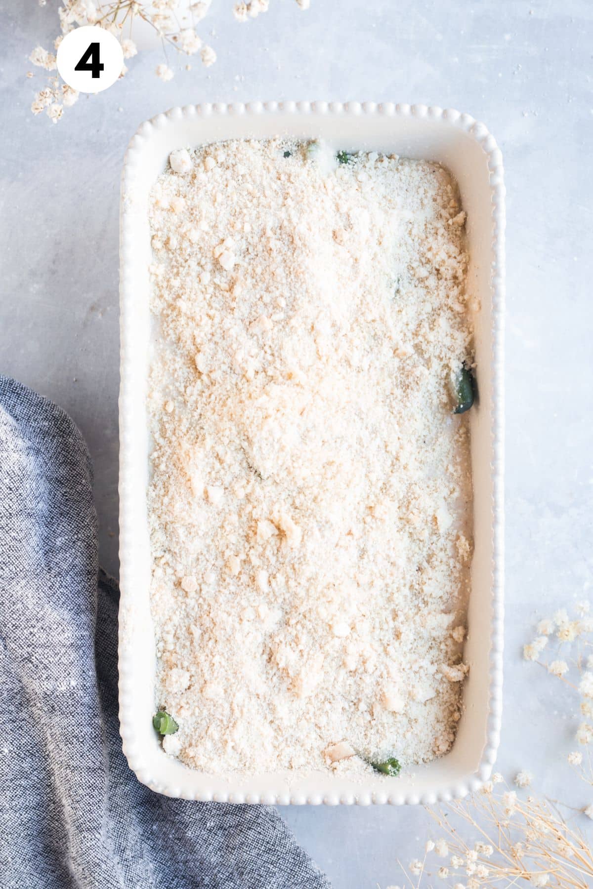 Unbaked green bean casserole in a baking dish.
