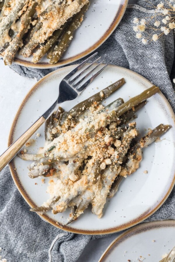 Healthy green bean casserole served on plates.