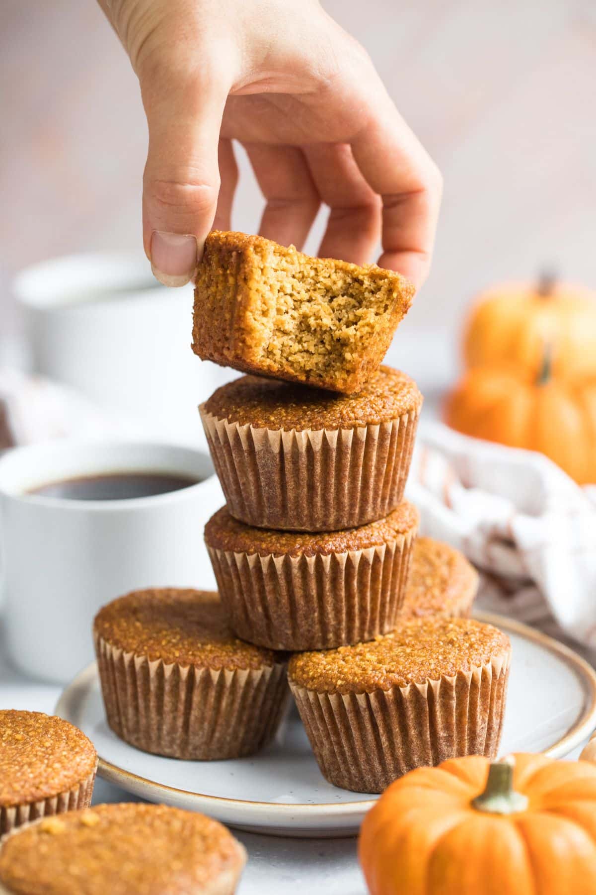 A stack of pumpkin cornbread muffins.