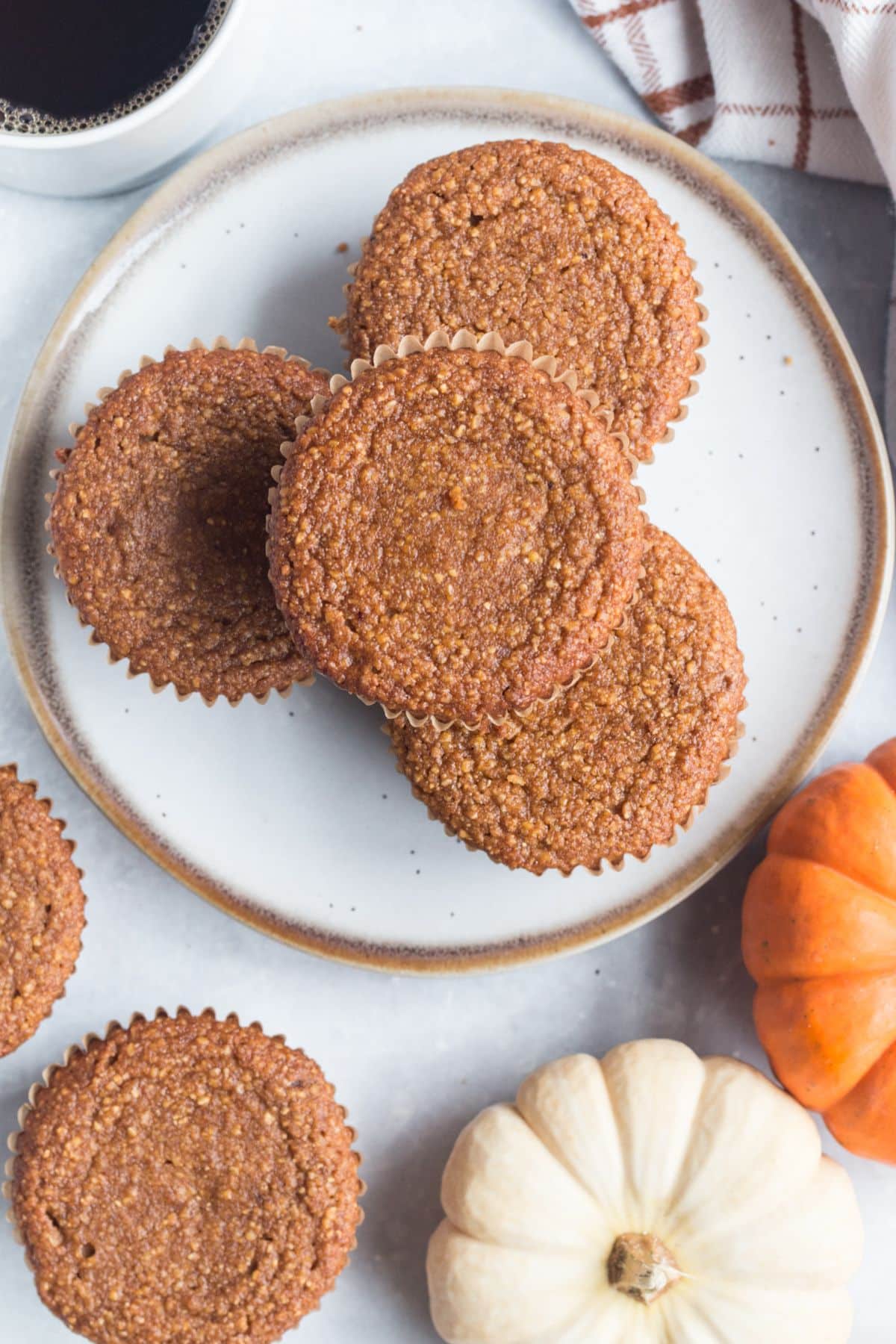 Pumpkin cornbread muffins on a plate.