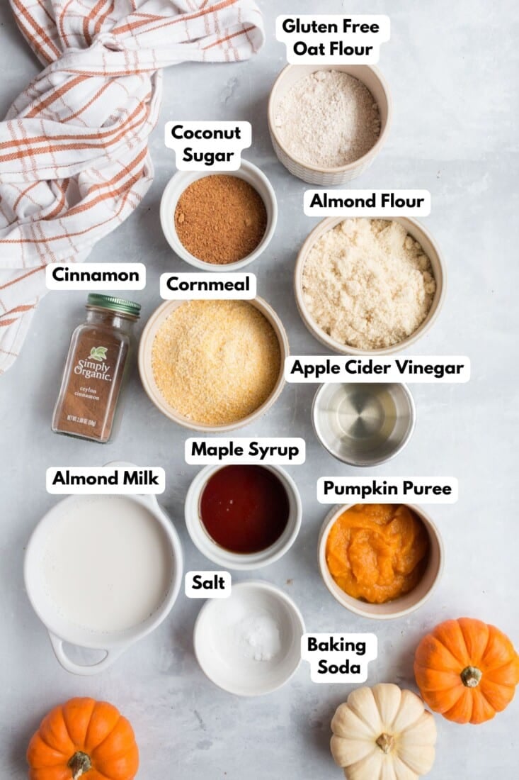 Ingredients for making pumpkin cornbread muffins in bowls.