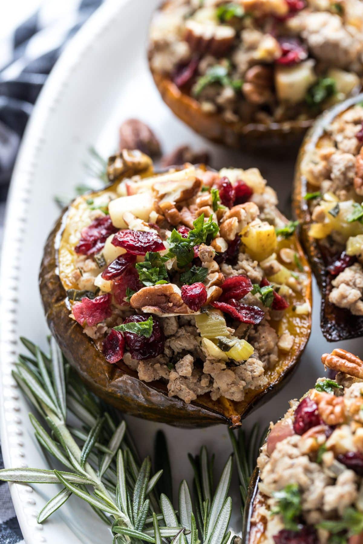 Turkey stuffed acorn squash on a serving dish.