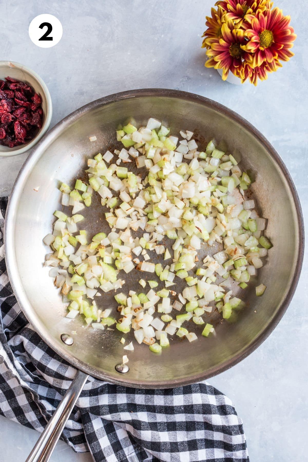 Aromatic ingredients for making the stuffing in a skillet.