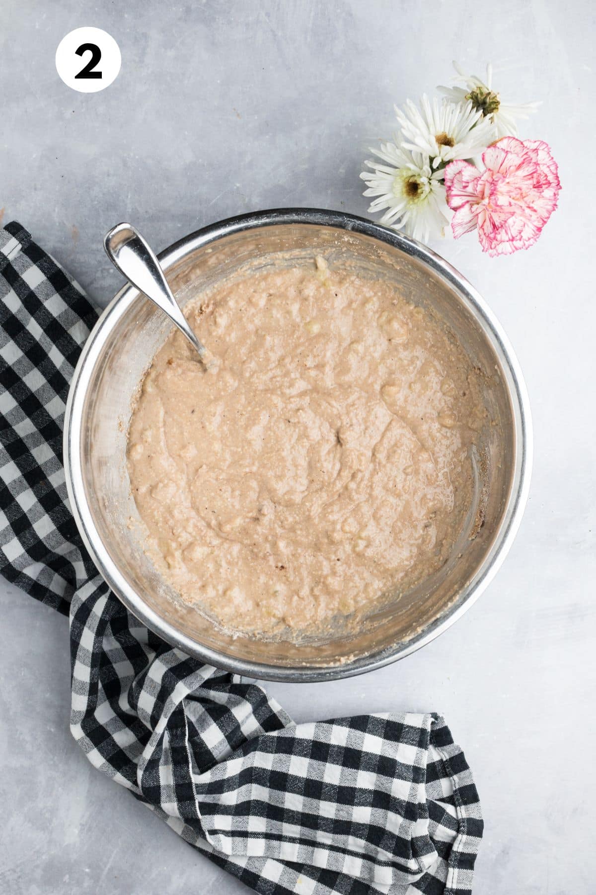 Banana muffin batter mixed in a bowl.