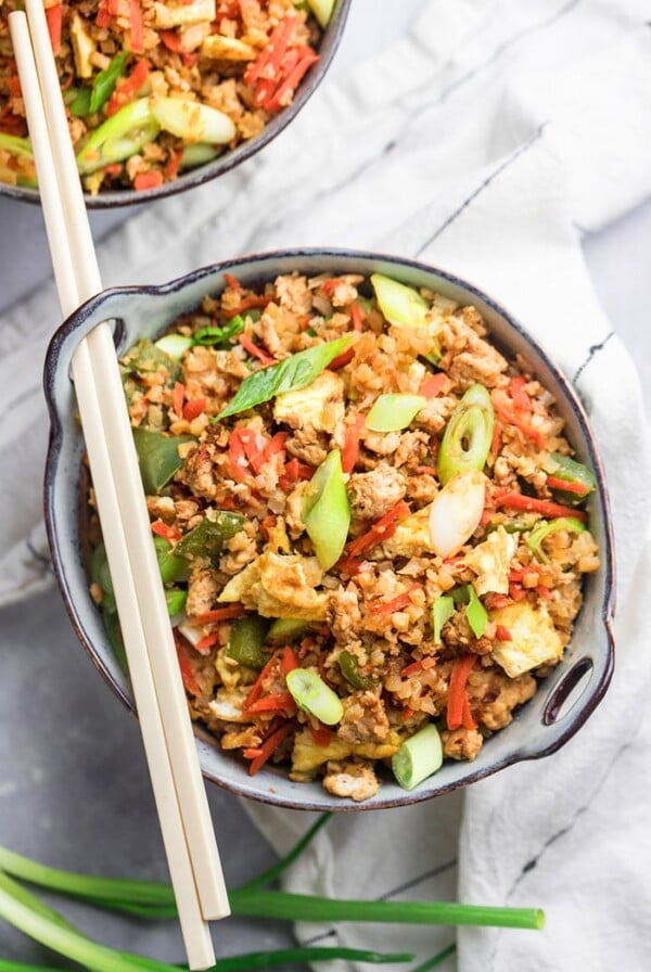 Healthy Fried Rice is protein and veggie packed, low calorie, low carb, full of flavor and so delicious! Make your own healthier takeout at home with this healthy fried rice dinner recipe! Low Calorie + Gluten Free + Low Carb + Paleo