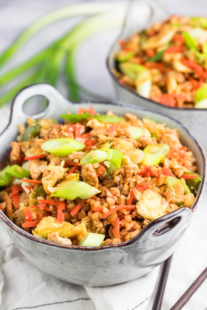 Healthy Fried Rice is protein and veggie packed, low calorie, low carb, full of flavor and so delicious! Make your own healthier takeout at home with this healthy fried rice dinner recipe! Low Calorie + Gluten Free + Low Carb + Paleo