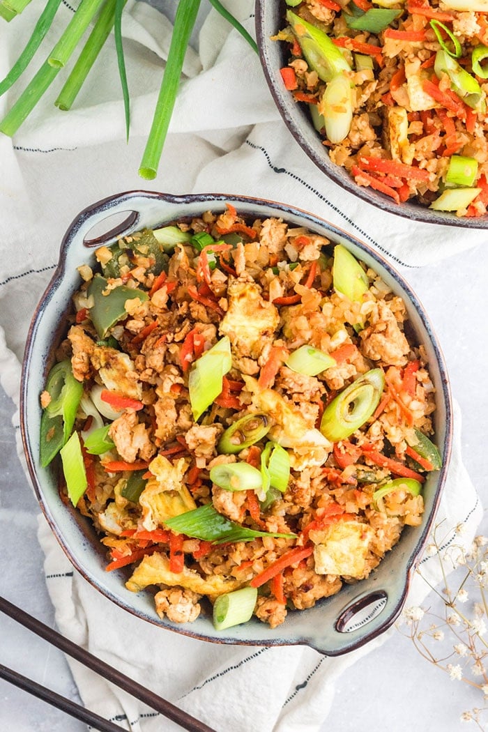 Healthy Fried Rice is protein and veggie packed, low calorie, low carb, full of flavor and so delicious! Make your own healthier takeout at home with this healthy fried rice dinner recipe! Low Calorie + Gluten Free + Low Carb + Paleo