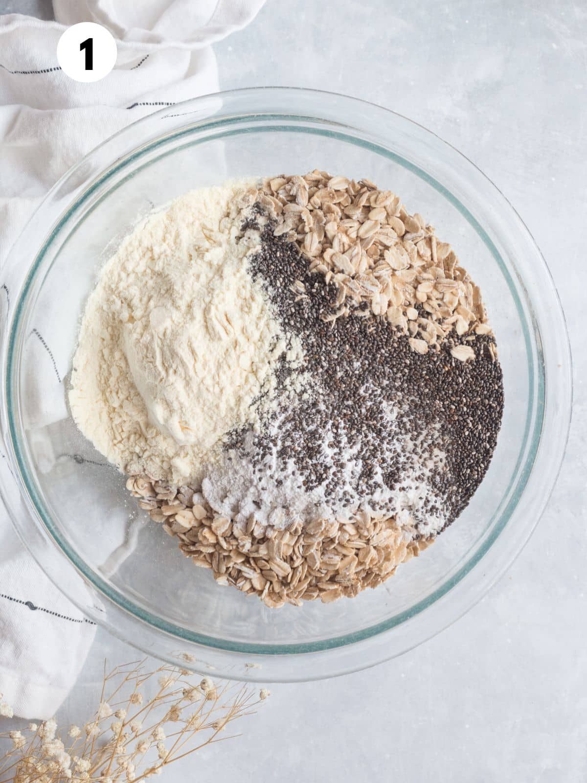 Ingredients to make baked protein oats in a glass mixing bowl.