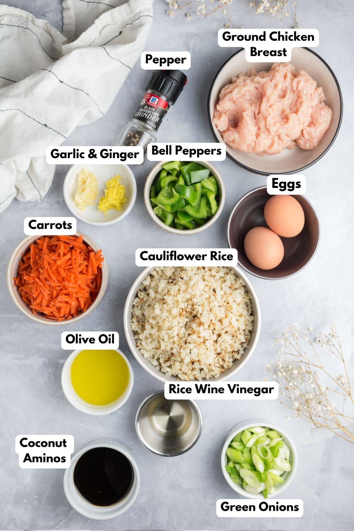 Ingredients to make a healthy fried rice stir fry on a table in bowls.