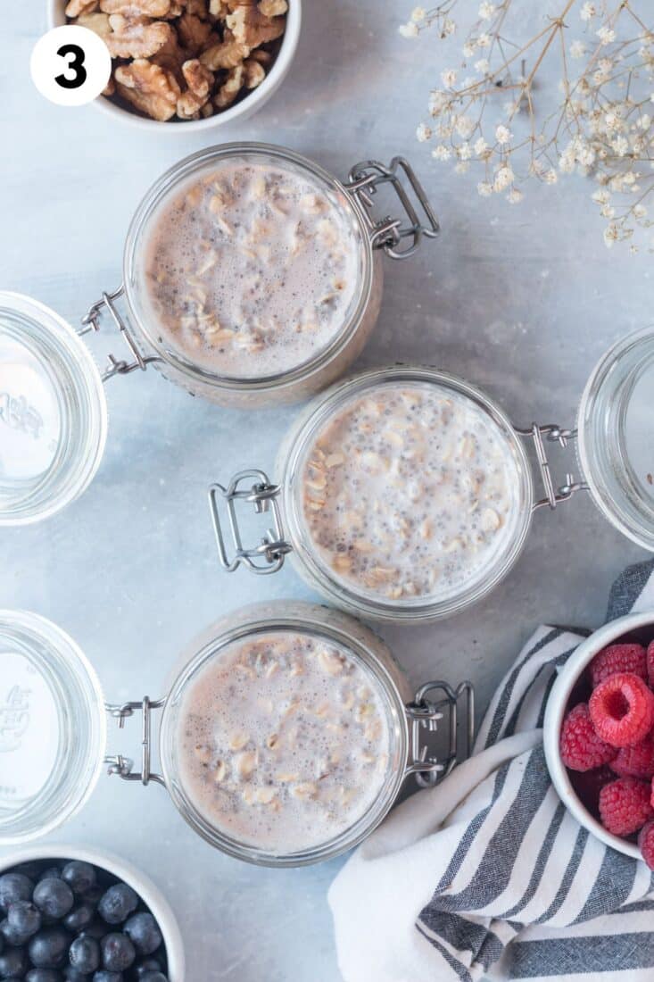 Overnight oat mixture added to jars. 